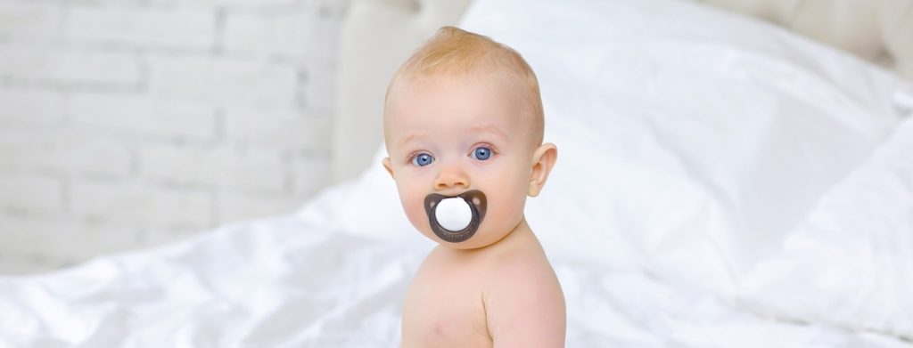 Baby Chewing on Pacifier