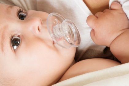 Baby Using Breast as Pacifier