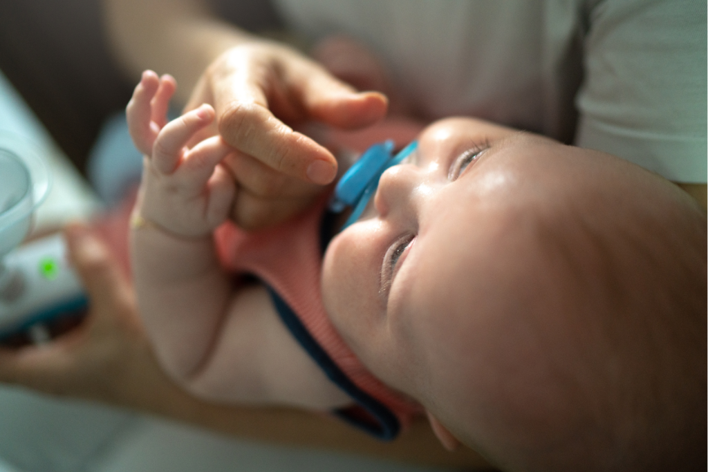 Baby Pushes Pacifier Out with Tongue